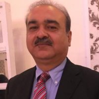 Professional portrait of the CEO of Markhor Digital Hub wearing a business suit, representing leadership and digital innovation.